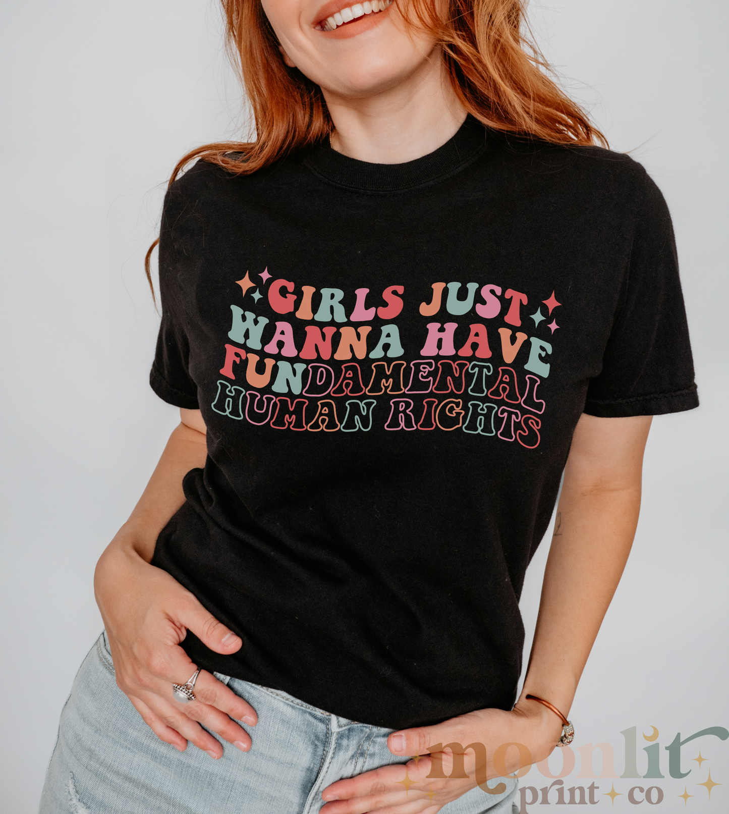 a woman wearing a t - shirt that says girls just wanna have human rights