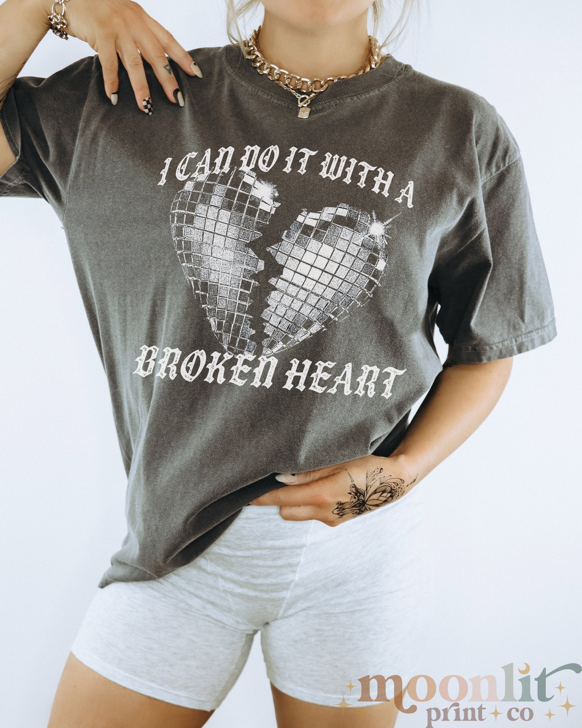 a woman wearing a shirt that says i can do it with a broken heart