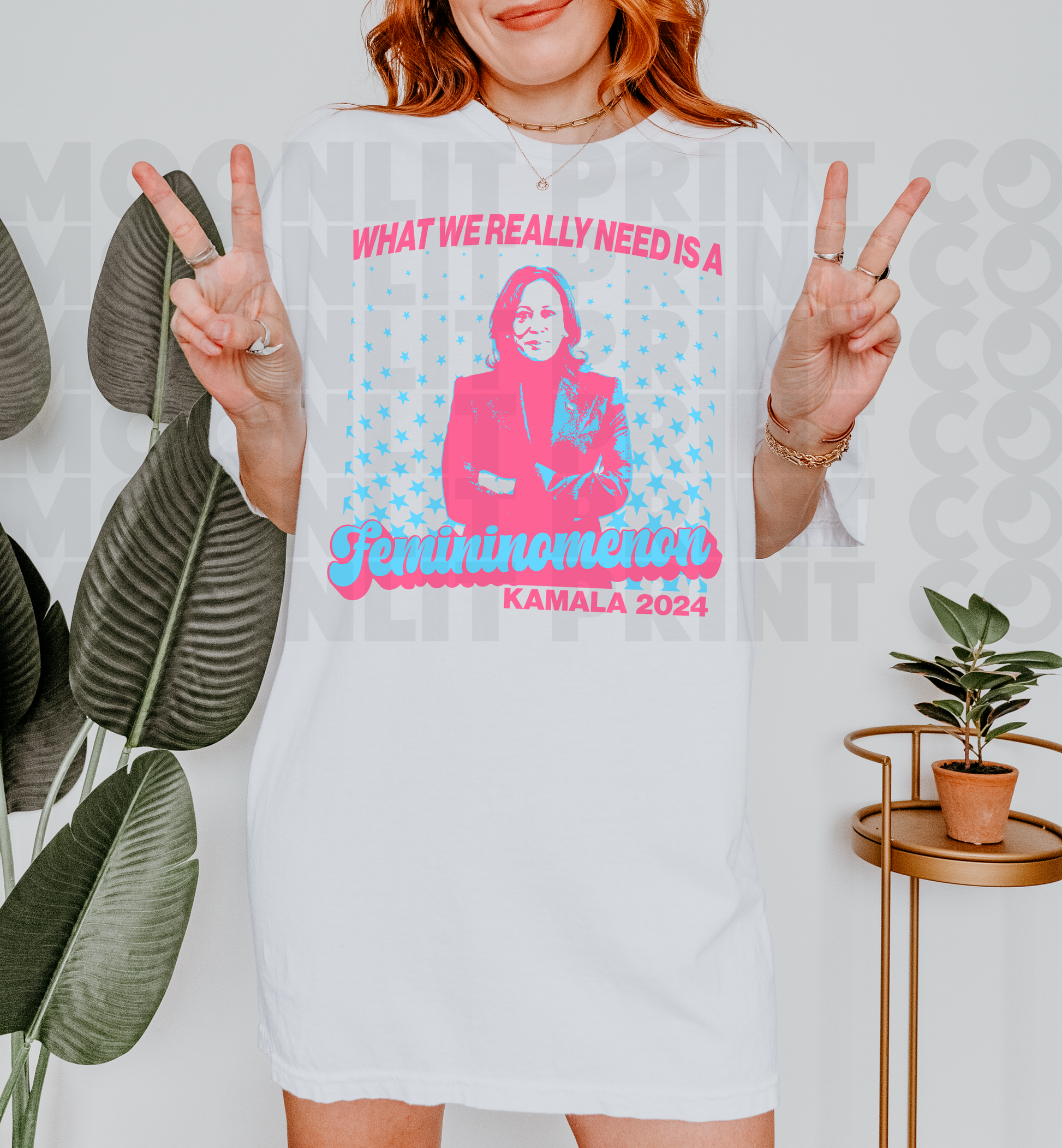 a woman wearing a t - shirt with a picture of a woman on it