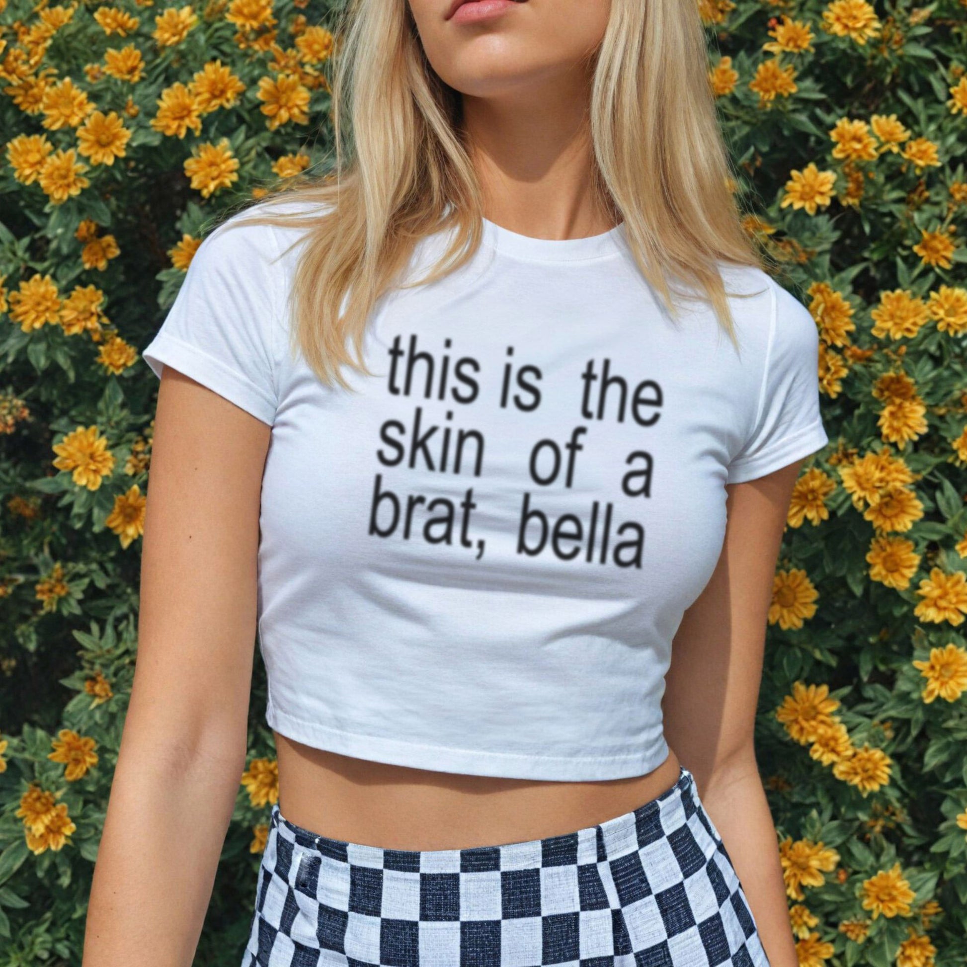 a woman wearing a white shirt with a black and white checkered skirt