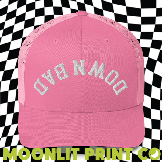 a pink trucker hat with the words moonlit print on it