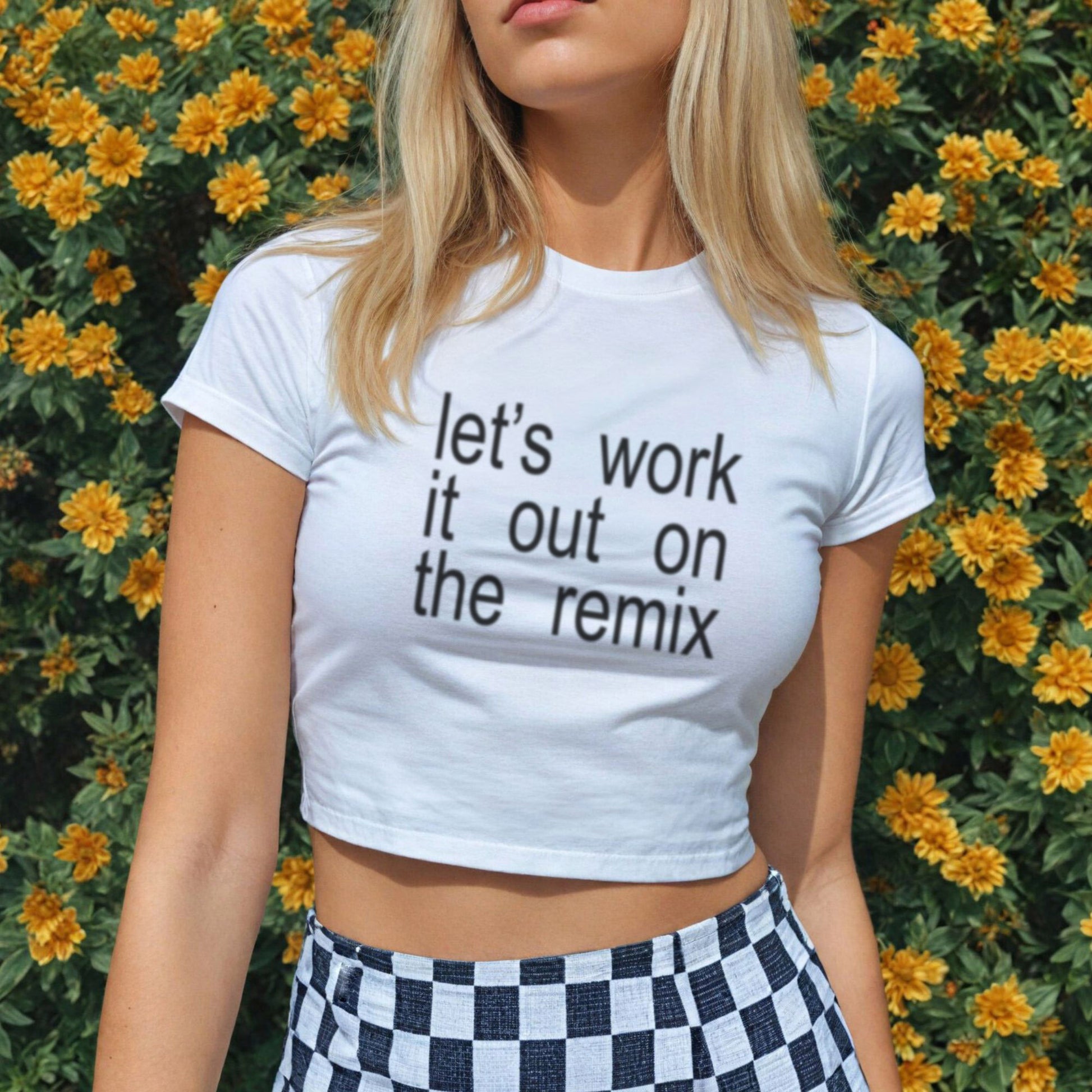 a woman standing in front of flowers wearing a t - shirt that says let '