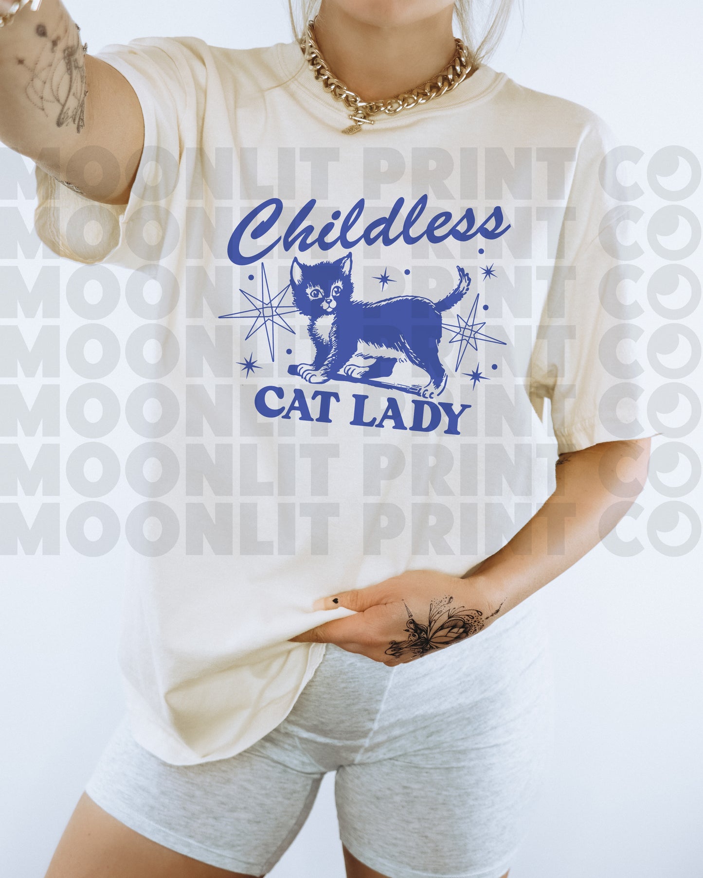 a woman wearing a white shirt with a cat lady on it