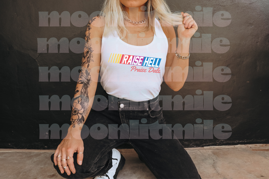 a woman sitting on the ground with a tattoo on her arm