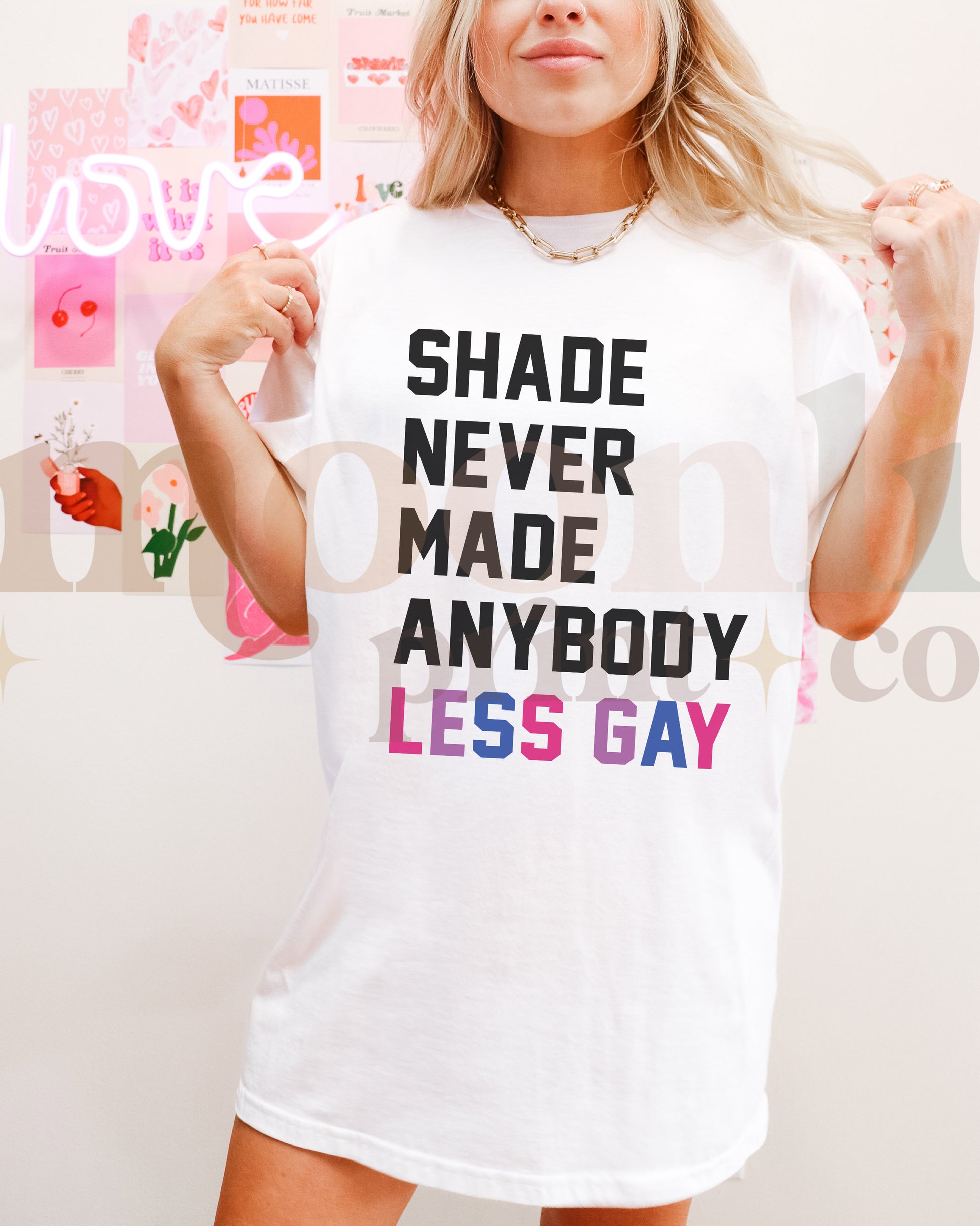 a woman wearing a white shirt that says, shade never made anybody less gay